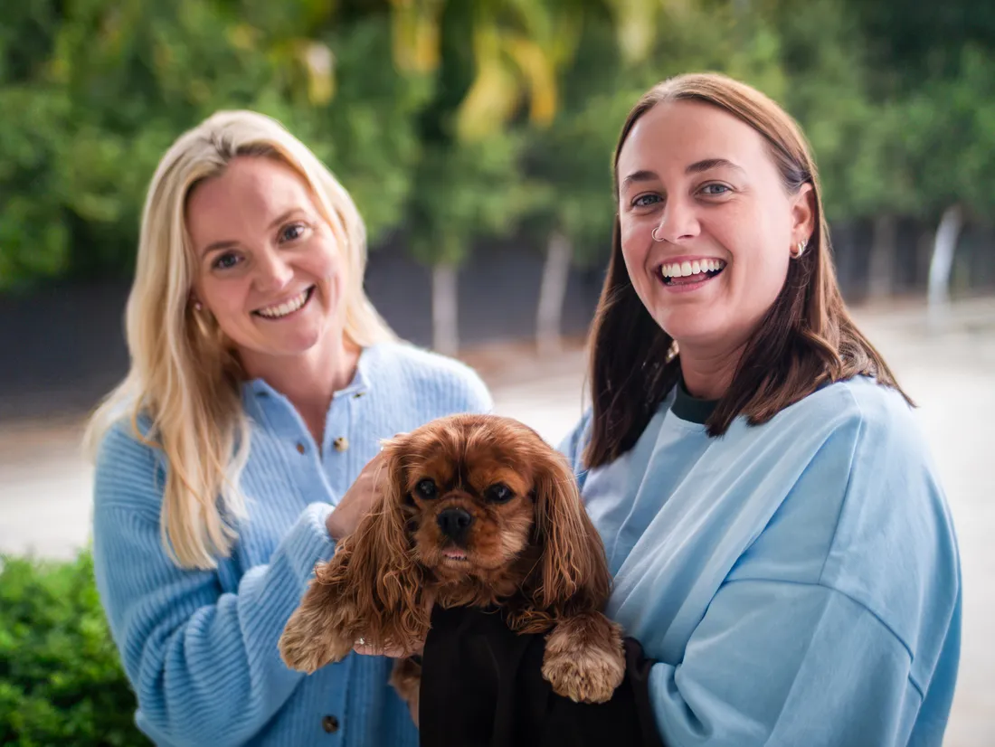 Hayley and Samantha with Bella outside the practice